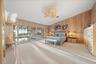 PRIMARY BEDROOM with gulf and pool access through the sliding glass doors