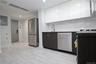 Kitchen with white cabinets, modern cabinets, appliances with stainless steel finishes, electric panel, and recessed lighting
