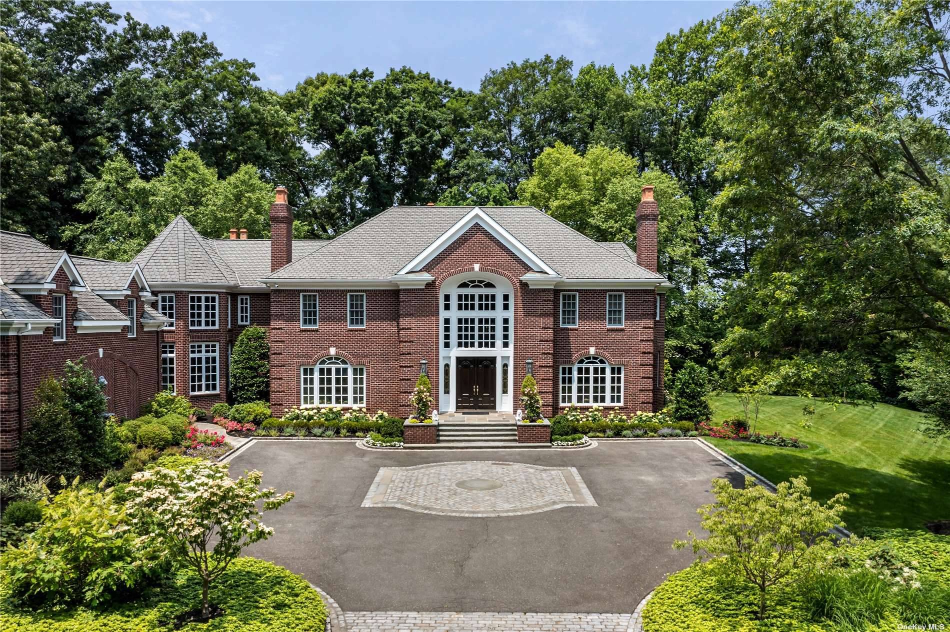 Located in the esteemed Village of Mill Neck, One La Colline Drive is a stunning 6 bedroom, 6.