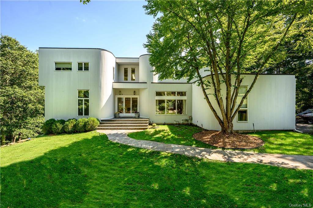 Fabulous modern home with an in ground heated pool set on 1 acres of beautiful property located on a desirable cul de sac in Briarcliff Manor.