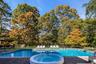 View of pool featuring a patio area and an in-ground hot tub
