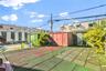 Fenced backyard with a shed
