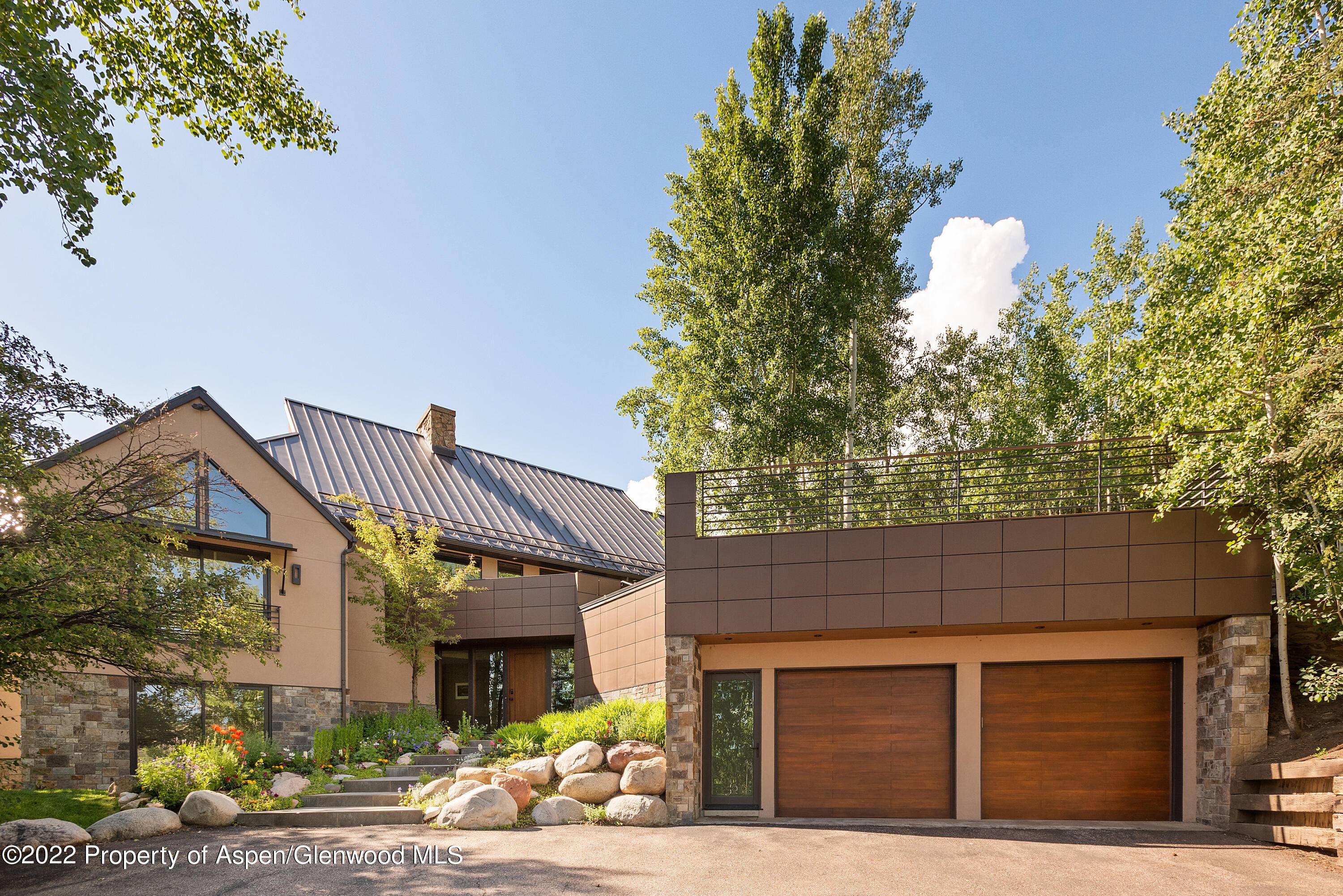 This mountain contemporary home is located in a lovely, private setting just.