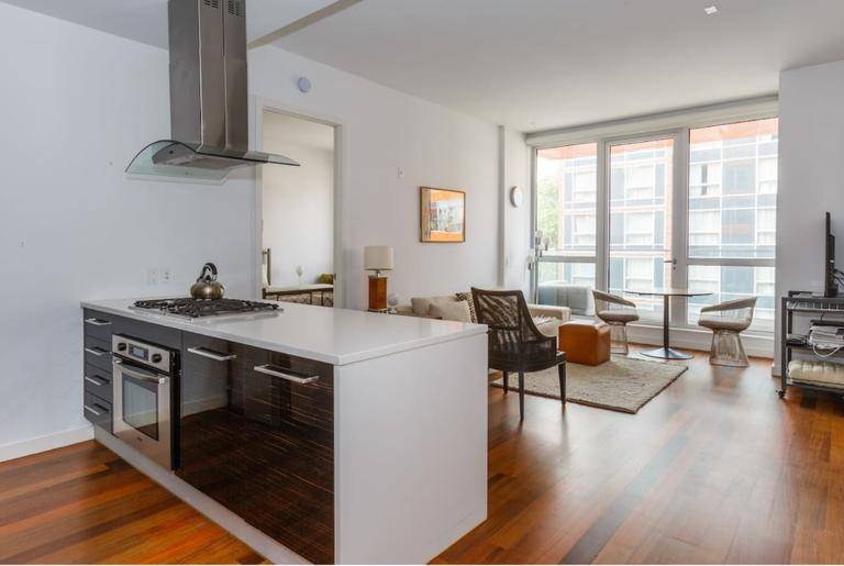 2 Bedroom 2 Bath Modern Condo in boutique buildingOpen living room with tall ceilings, floor to ceiling windows, loft like, and light.