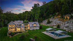 Set on 6. 2 idyllic acres nestled between a river dramatic stone cliff the calming power of nature creates the ultimate sanctuary where privacy meets prestige.