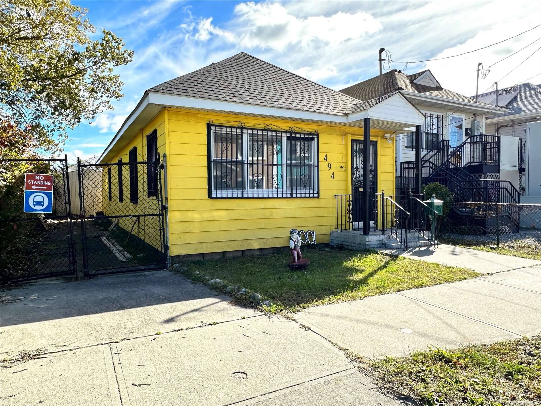Discover the perfect blend of classic charm and modern sustainability in this inviting bungalow nestled in the heart of Far Rockaway.