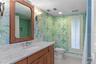 Bathroom #2 is en-suite to Bedroom #2 and also accessed from hallway for guests. Tub/Shower