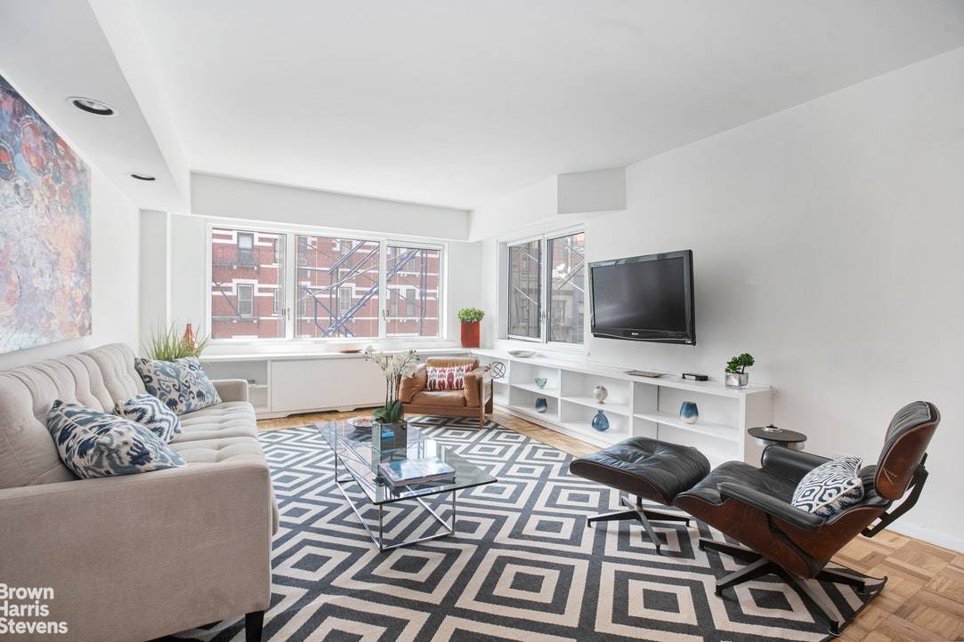 Sunny and cheerful, this super oversized one bedroom in a full service, doorman building, is in the heart of the Upper East Side.
