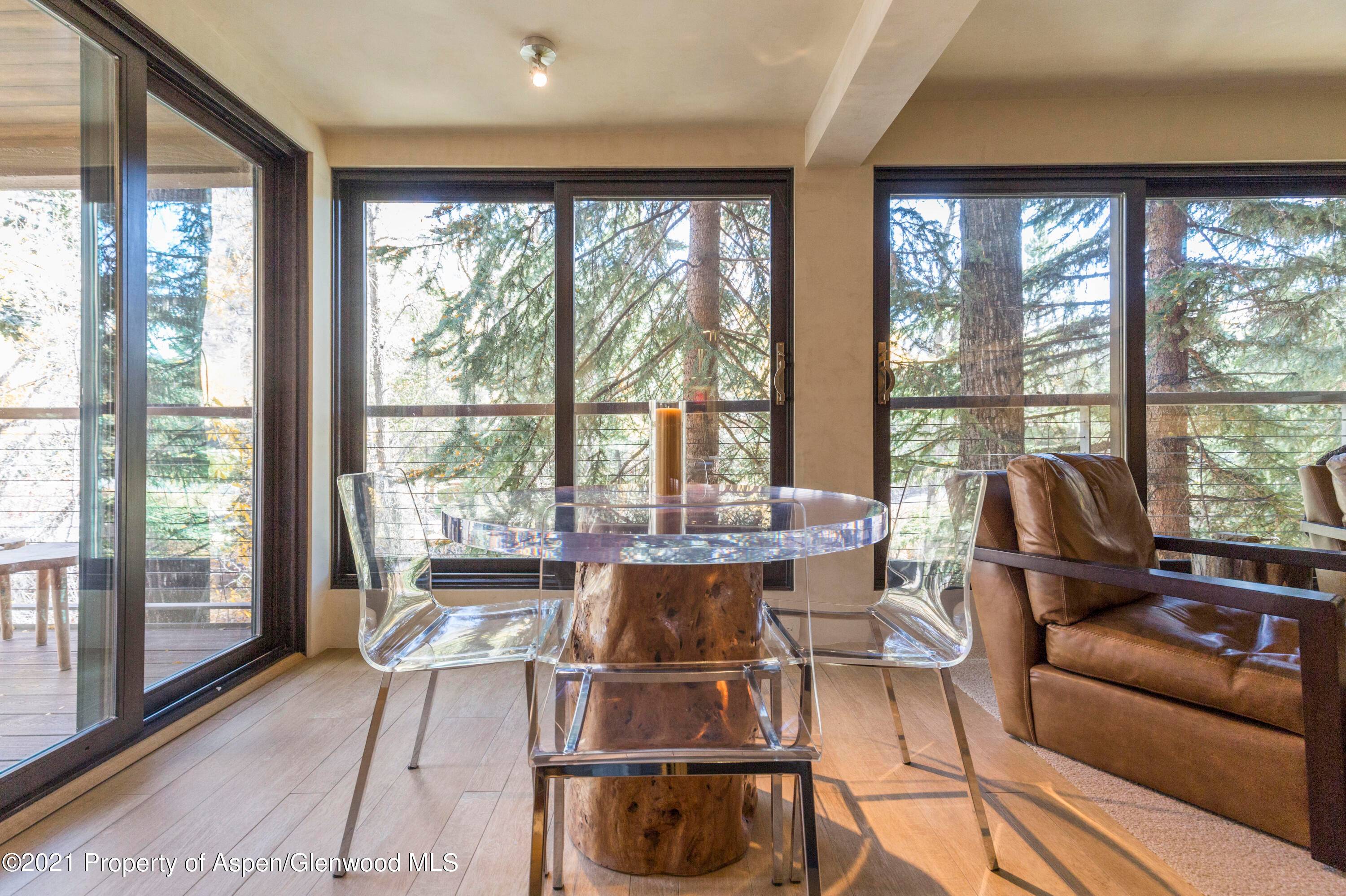 Beautifully remodeled, contemporary riverfront condo with exquisite custom details throughout.