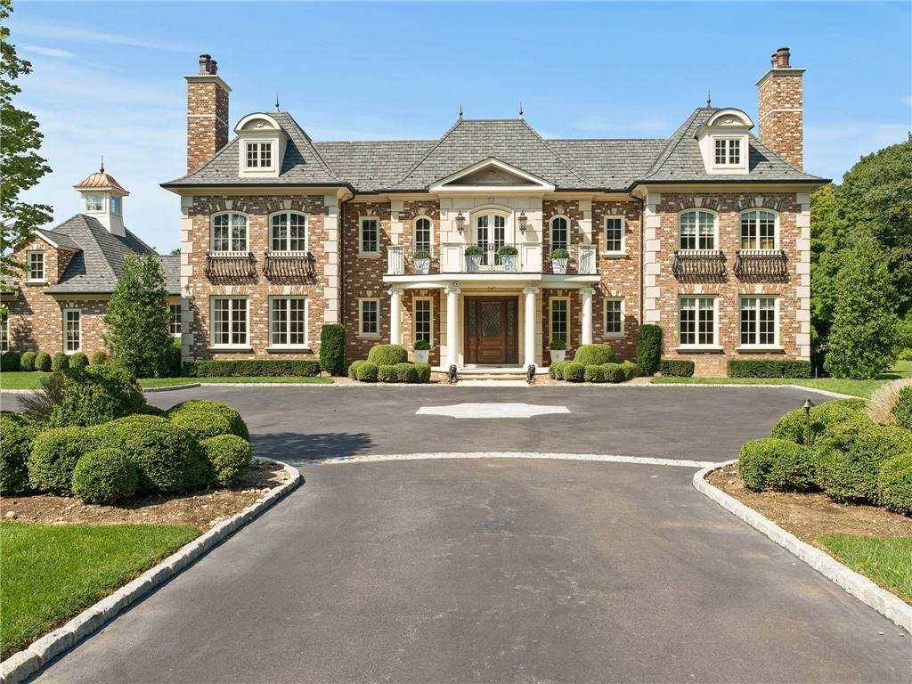 Exquisite 7 Bedroom Custom Colonial Set on 4 Park Like Acres.
