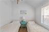 Bedroom with vaulted ceiling and hardwood / wood-style floors