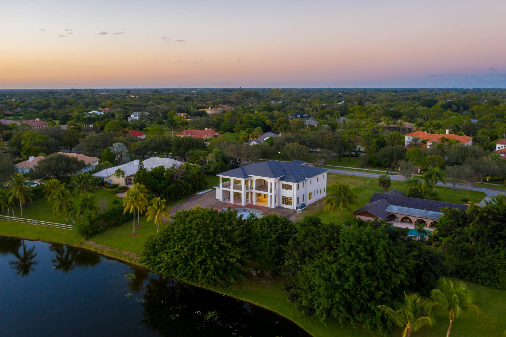 NEW PRICE ! ! Brand New Magnificent Lakefront Estate in the coveted private gated community of Steeplechase in the heart of Palm Beach Gardens.
