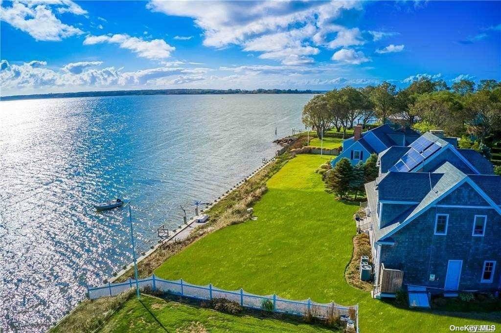 Orient village bayfront offering water views on a beautifully landscaped shy acre at 1060 Willow Terrace, Orient.