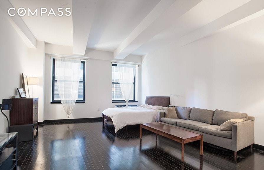 Gorgeous 888 sqft. loft studio apartment impeccably designed by Armani Casa and accentuated by ebony oak floors and concealed cabinetry giving this home a modern and open feel.