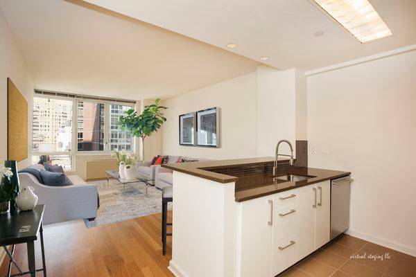 Well appointed 1 bedroom with open gourmet kitchen with stainless steel appliances, stone countertops, and eating bar and an in unit washer dryer.