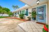 Front entryway - glass pane door and seashell paver front porch