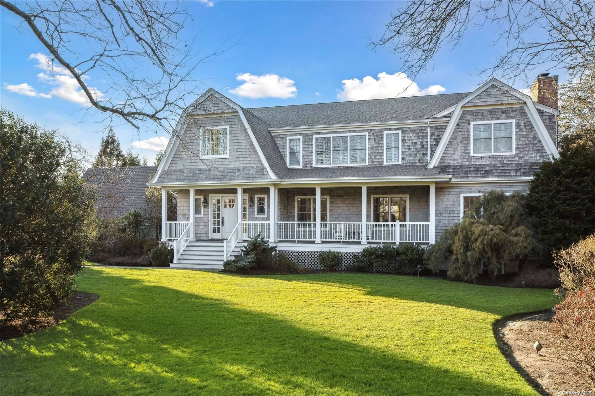 Halfway down Rogers Lane, this beautiful Nantucket shingle style home beckons you in.