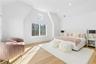 Bedroom featuring vaulted ceiling, light wood finished floors, and recessed lighting