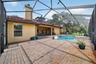 xpansive Covered & Screened Lanai with Paver Pool Deck