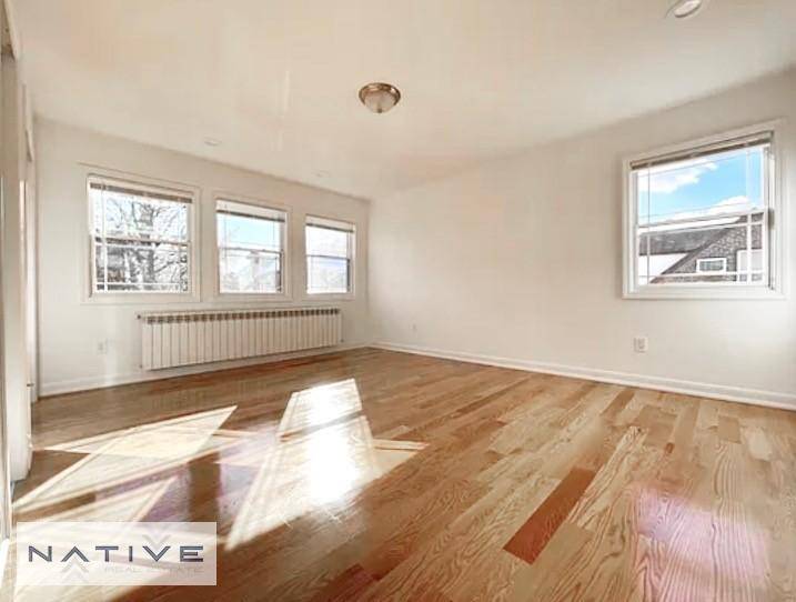 Beautiful brick home in uptown Middle Village with lots of light exposure throughout everyroom.