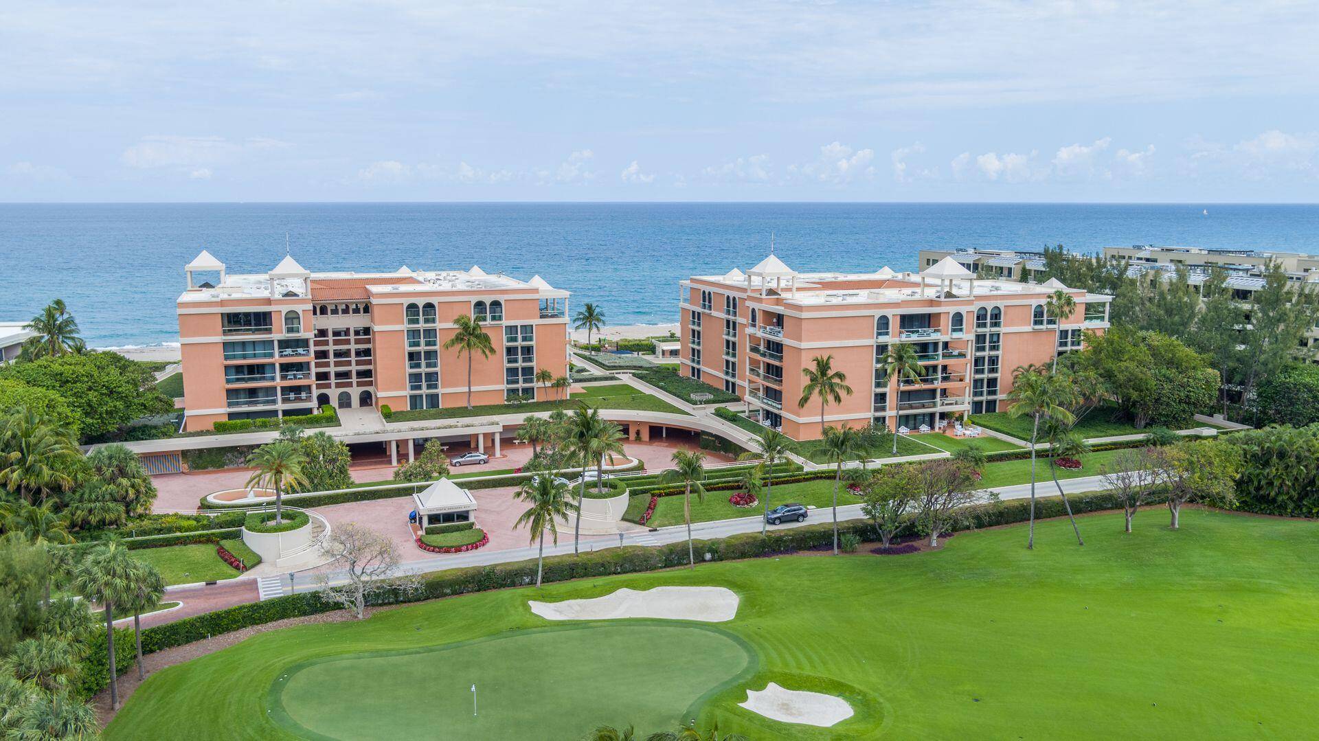 Extraordinary sunset views over expansive lawn and palm tree filled Breakers golf course.