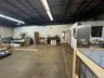 Misc room featuring a workshop area and a garage