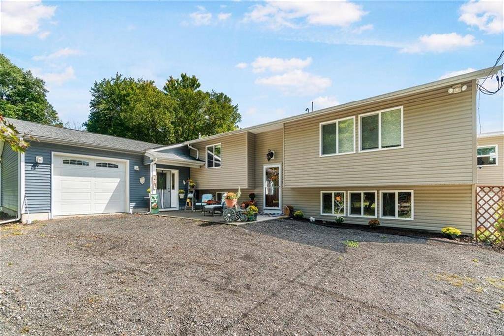 A Great Opportunity to Own a 4 Bedroom Raised Ranch with an Attached one bedroom Accessory Unit on 7 Acres in Goshen, NY This hidden gem offers privacy and so ...