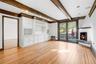 Family room with fireplace. French doors to large patio and backyard.