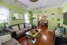 Living area featuring wood-type flooring and track lighting
