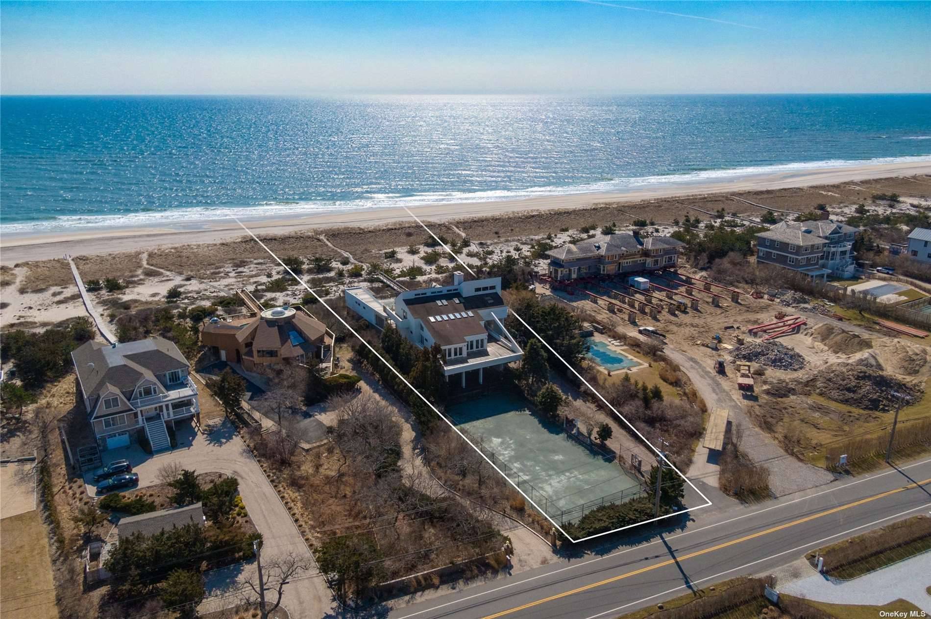 Perfectly situated between the bridges on over an acre with 112 feet of oceanfront.