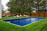 View of pool featuring a fenced backyard, a patio, and an outdoor hangout area