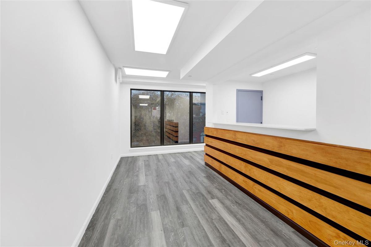 Reception room featuring baseboards and light wood-style floors