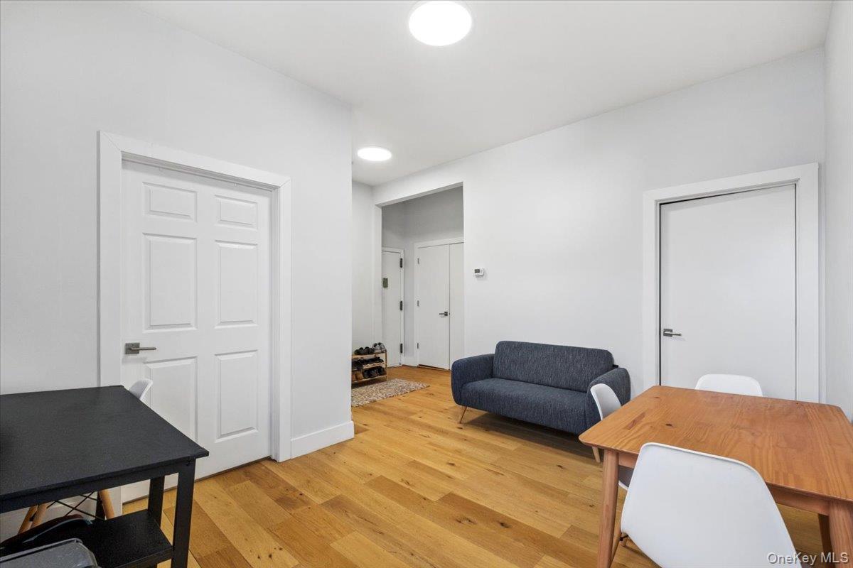 1st Floor Apartmentliving room features light-colored walls and hardwood flooring