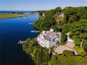 Incomparably set on nearly an acre of uniquely curved direct waterfront property with 188 feet of frontage with a dock, this magnificent home has breathtaking vistas of Southport Harbor, Long ...