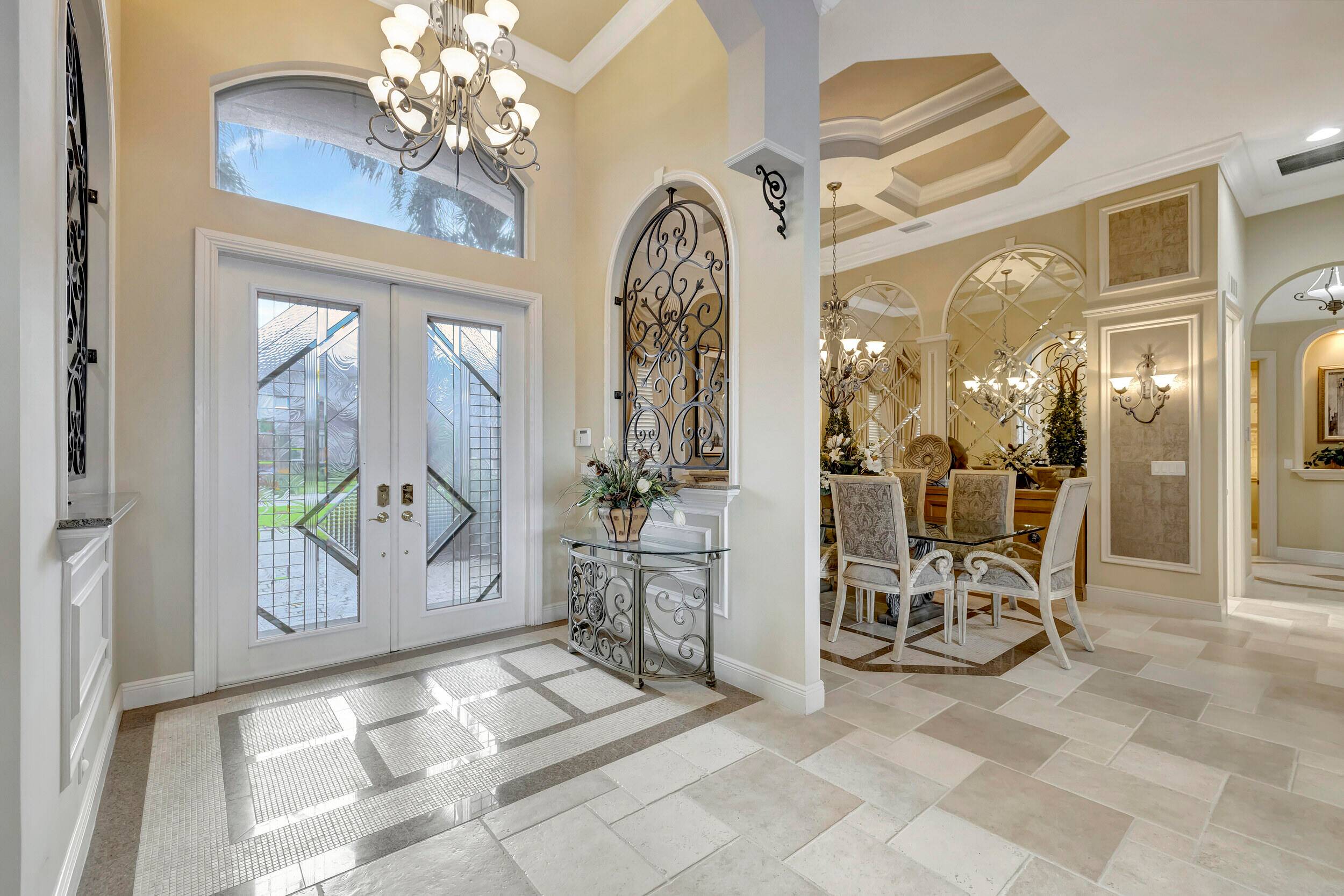 Welcome to the beautiful Provence section of Versailles of Wellington and to this former builder's model, professionally decorated, completely furnished, and barely lived in.