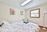 Carpeted bedroom featuring baseboards