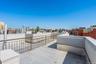 View of patio featuring a skyline view