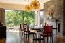 Dining space featuring dark wood-style flooring and ornamental molding