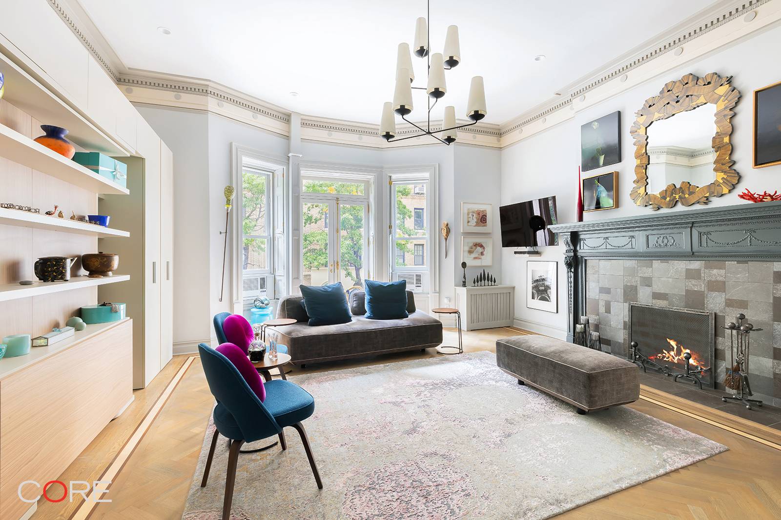 This is a meticulously curated gut renovation of the formal front parlor on the second floor of an elegant 1895 Renaissance Revival townhouse.