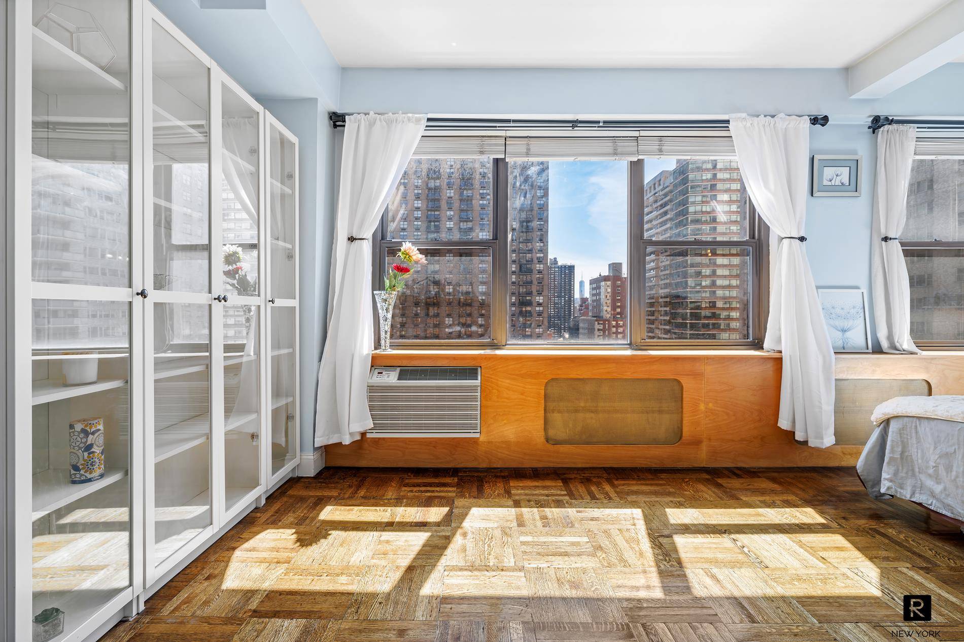 Sunny amp ; south facing alcove studio with stunning city views, including World Trade Center views !