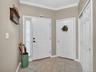 Doors leading to the entry pathway, the garage, and a closet.