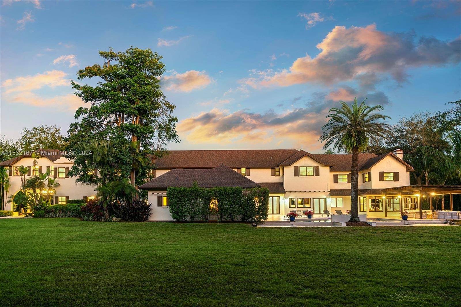Nestled in Pinecrest, this traditional charm w modern updates estate graces a stunning 1.