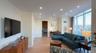 Living area featuring light wood-style flooring, recessed lighting, expansive windows, and crown molding