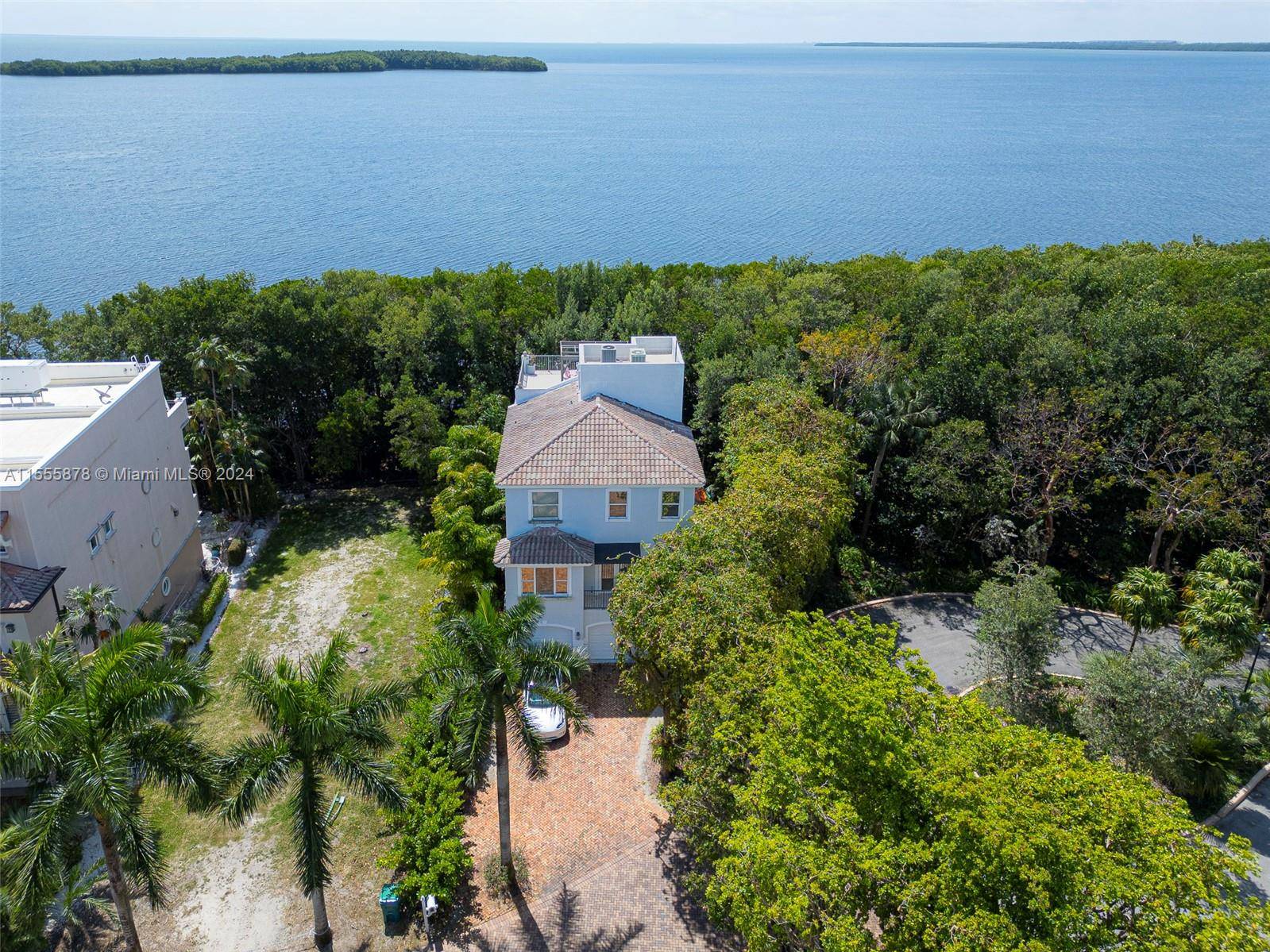 Enjoy the breathtaking water views from this amazing BAYFRONT 4 story home in Paradise Point.