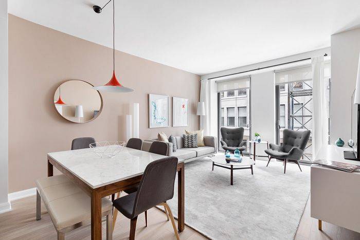 Gorgeous light filled two bedroom, with walls of windows in every room, an open gourmet kitchen with stainless steel appliances and quartz countertops, split bedrooms, and multiple closets.