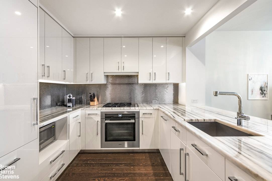 Welcome to luxury living at its finest in this impeccably designed two bedroom apartment bonus room, nestled in the prestigious One Riverside Park condominium.
