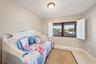 This space, adjacent to the kitchen, could be a home office, additional sleeping area or flex the space however you wish