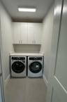 2nd Laundry Room Upstairs with 42" Upper Cabinets and Quartz Countertop!