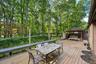 Deck featuring a gazebo and outdoor dining area