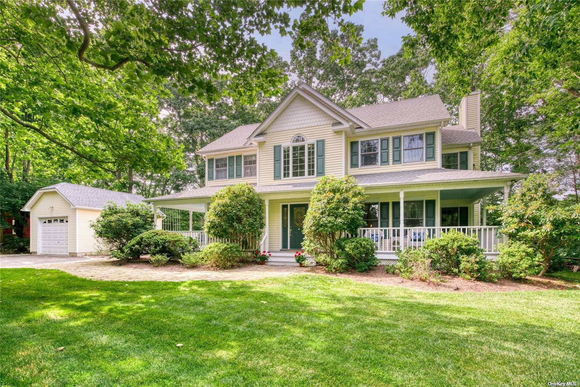 Located in the quiet neighborhood, Yennecott, behind a row of mature rhododendrons a spacious Waterfront Farmhouse with wrap around porches.